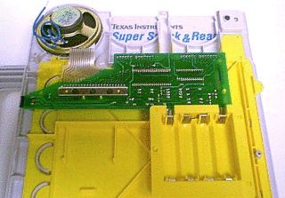 The internal board, ribbon connections, speaker, and battery compartment.