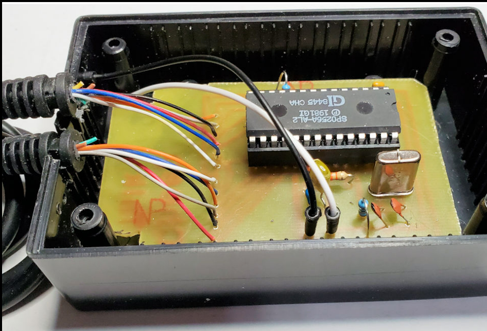 SP0256A-AL2 speech synthesizer chip mounted in its Cheep Talk project enclosure; the chip label is clearly visible.