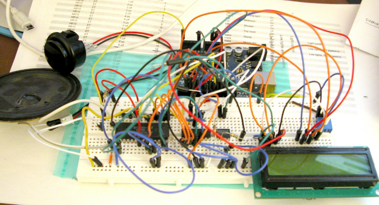 Homemade Hawking Arduino speech-synthesizer prototype on a breadboard, with jumper wires, speaker, and LCD.
