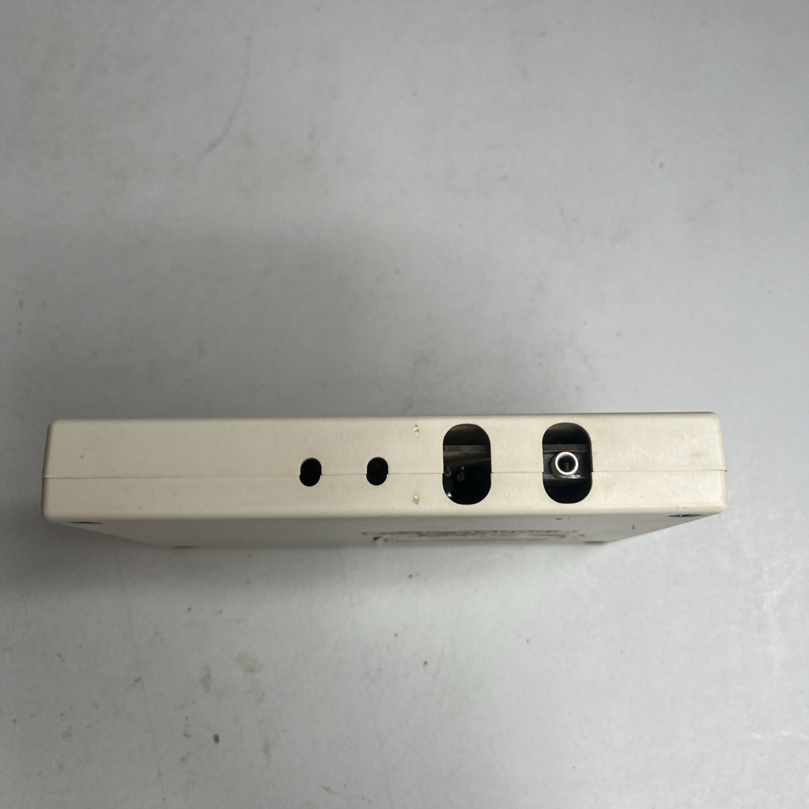 Side audio jack and adjacent opening